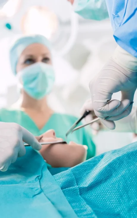 Dentist performing procedure in surgery room