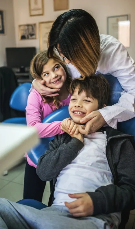 Children being examined by dentist